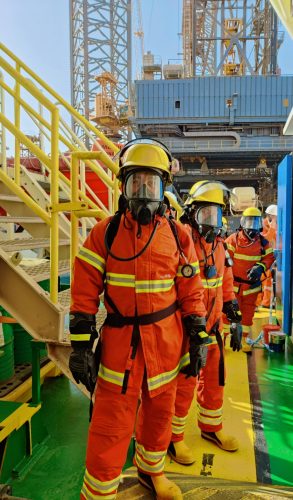Firefighters wearing gas masks and gear at Ras Laffan industrial facility, Qatar.